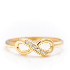 14k Solid Gold Iconic Infinity Ring, Real Gold Premium Infinity Band, Unique Design Ring For Her, Handmade Fine Jewelry By Selanica. 💙 The ring material is 14k solid gold, should not be confused with gold plating or filling. It will never tarnish or fade over time. We're offering the finest quality in solid gold jewelry. 💎 Gemstones are premium grade D Color (colorless) VS/SI clarity moissanites.  💙 Our jewelry is handcrafted with love and great care at San Francisco Bay! All of our items are 14k stamped for authenticity. You will receive them exactly as pictured.  💙 Quick shipping - Your order will be handcrafted and shipped in a few days. 🎁 They are delivered in a nice jewelry box, ready to be presented as a precious gift. 💎 Moissanite is the best alternative for natural diamonds a Gold Infinity Ring, Natural Pearl Ring, Unique Promise Rings, Infinity Band, Gold Pearl Ring, Nice Jewelry, Precious Gift, Gold Rings Fashion, Handmade Fine Jewelry