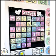 a bulletin board with numbers and magnets attached to the back of it that says, august