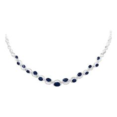 Fine Jewellery Blue Sapphire Diamond White Gold Drop Link Necklace | From a unique collection of vintage Drop Necklaces at https://www.1stdibs.com/jewelry/necklaces/drop-necklaces/. Classic Blue Diamond Necklace With 17 Jewels, Formal Blue Oval Diamond Necklace, Formal Blue Diamond Gemstone Necklace, Formal Blue Gemstone Diamond Necklace, Formal Round Sapphire Necklaces, Blue Oval Diamond Necklace In Fine Jewelry Style, Blue Oval Diamond Necklace Fine Jewelry, Oval Sapphire Necklace With Hallmark, Classic Blue Diamond Anniversary Necklace