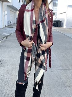 Bundle up in our BooBerry Plaid! So soft, warm and oh-so classic. It's the perfect cool weather accessory that you'll wear every time you leave the house! Plush & neutral in burgundy, tan, ivory & black plaid with fringe trim detail. Super cute. Approx. measurements:O/S: 72"L, 26.5"W100% Acrylic; ImportedCare:Hand Wash ColdDo Not BleachHang or Lay Flat to DryWarm Iron if Needed