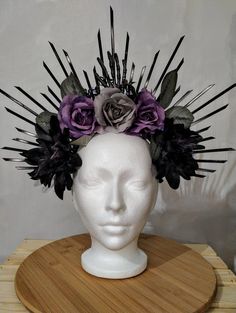 Embrace your dark, mystical side with the **Halo De Muertos Crown**--the ultimate accessory for Gothic-themed outfits, Halloween costumes, festivals, or Dia De Muertos celebrations. This **handmade-to-order** crown is intricately crafted with black and dark purple roses, adorned with a skull and spiders on a sturdy metal headband, creating a hauntingly beautiful look. Each **limited-edition** headpiece is uniquely made, ensuring no two crowns are exactly the same. The creation process takes **3-5 days** to complete, allowing the paint and glue to dry for a flawless, long-lasting finish. To ensure delivery by Halloween on October 31st, make sure to **order by October 20th This exclusive crown is perfect for festivals, parties, Gothic weddings, and any Halloween or Dia De Muertos event. Don' Goth Flower Crown, Gothic Headpieces For Cosplay And Festivals, Adjustable Gothic Costume Accessories For Fantasy Events, Mystical Headpieces For Halloween Party, Mystical Halloween Party Headpieces, Fantasy Headpieces For Halloween Costume, Handmade Gothic Costume Hats And Headpieces For Parties, Handmade Gothic Costume Hats And Headpieces, Fantasy Halloween Costume Headpiece