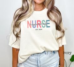 Comfort Colors® Nurse shirt, Registered Nurse Shirt, RN Shirt, Heart RN Shirt, Nursing Shirt, Nursing School Tee, Nurse Week Shirt, Nurse Student Shirt Personalized Nurse Shirt, Registered Nurse Shirt, RN Shirt, Custom Year RN Shirt, Nurse Est Shirt, Nurse Shirt, Nursing Shirt   ❤ Comfort Colors Brand ❤ Unisex Adult Sizing ❤ 100% Cotton ❤ DTG (Direct To Garment) printing, which means the ink is directly printed into the fabric Additionally, since all items are custom made to order, we do not accept returns or exchanges. Please carefully review the sizing details provided, as our t-shirts are unisex and not specifically tailored for women. For a slimmer fit, ladies should consider ordering one size down. Many designs in our shop can be customized, but additional costs may apply depending on White Nursing Friendly Short Sleeve Tops, Relaxed Fit Nursing Top With Short Sleeves, White Casual Nursing Shirt, Casual Nursing Shirt With Short Sleeves, Short Sleeve Cotton Nursing Tops, Cotton Short Sleeve Nursing Tops, Cotton Nursing Tops With Short Sleeves, Cotton Relaxed Fit Top For Nursing, Casual Short Sleeve Nursing Shirt