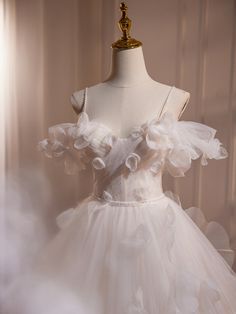 a white dress with ruffles on it