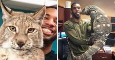 two men are smiling and one is holding a large cat in an office with other cats