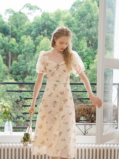 A French dress depicting a red rose. There is a small flower decoration on the chest, and the entire dress is decorated with embroidery that outlines the shape of petals. The sheer, fluffy sleeves make you look like a lovely young lady. 
 
 
 Size 
 
 S size 
 
 Length: 116cm 
 Shoulder width: 31cm 
 Bust: 80-83cm 
 Waist: 66cm 
 Sleeve length: 28cm 
 
 
 M size 
 
 Length: 118cm 
 Shoulder width: 32cm 
 Bust: 84-87cm 
 Waist: 70cm 
 Sleeve length: 29cm 
 
 
 L size 
 
 Length: 120cm 
 Shoulder Cottagecore Party Dresses For Spring, Spring Party Cottagecore Dresses, Cottagecore Square Neck Party Dress, Spring Rose Print Dress With Fitted Bodice, Feminine Spring Vintage Dress With Square Neck, Spring Dresses With Rose Print And Fitted Bodice, Rose Print Dress With Sweetheart Neckline For Garden Party, Garden Party Dress With Rose Print And Sweetheart Neckline, Feminine Square Neck Vintage Dress For Spring