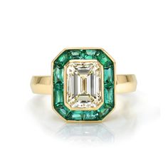 2.00ct M/VVS1 GIA certified emerald cut diamond with 1.05ctw French cut green emeralds bezel set in a handcrafted 18K yellow gold mounting. Luxury Green Emerald Ring With Bezel Setting, Luxury Octagon Emerald Ring With Bezel Setting, Luxury Emerald Baguette Cut Bezel Set Ring, Luxury Emerald Cut Emerald Ring With Bezel Setting, Luxury Emerald Cut Ring With Bezel Setting, Green Octagon Emerald Ring With Bezel Setting, Luxury Yellow Gold Emerald Cut Emerald Ring, Luxury Yellow Gold Emerald Cut Ring, Emerald Cut Emerald Ring With Bezel Setting