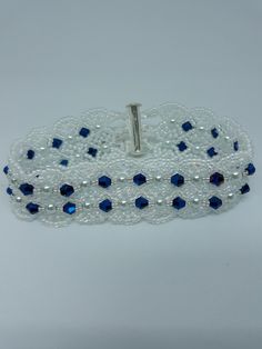 This handmade beautiful bracelet is made of quality materials. It measures 7 1/2 inches, and has a silver slide bar clasp. If you like high fashion you will love this one. Made with navy blue crystals, white pearls, white iridescent seed beads, jewelry line. Elegant Beaded Cuff Bracelet As Gift, Elegant Beaded Cuff Bracelet For Gift, Adjustable Elegant Beaded Bracelets, Unique Beaded Bracelets For Wedding, Handmade Adjustable Bracelet For Formal Occasions, Handmade Adjustable Cuff Bracelet For Party, Handmade Elegant Crystal Bracelet For Party, Handmade Adjustable Cuff Bracelet For Parties, Handmade Elegant Crystal Party Bracelet