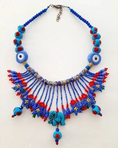 -Check out our shop for unique best handmade pieces -This necklace is a unique handmade design. -Product Features: -Materials: evileye,bead, crystal, coton rope -Color: red, blue, green   SHIPPING: -Free shipping to worldwide on all orders.Delivery time is usually 2-6 days for USA. It is 2-6 days for Canada. It is 3-8 days for European countries. PACKAGING: -All our products are shipped in high quality boxes,ready for gift-giving. *All my products are handmade design by myself. *Unique piece See Handmade Blue Beaded Festival Necklaces, Handmade Beaded Necklaces For Festivals, Eye-catching Handmade Jewelry For Gifts, Handmade Turquoise Beaded Necklaces, Handmade Turquoise Beaded Necklace For Festivals, Unique Handmade Turquoise Beaded Necklaces, Handmade Blue Beaded Necklaces For Festivals, Handmade Blue Necklaces For Festivals, Handmade Blue Necklace For Festivals