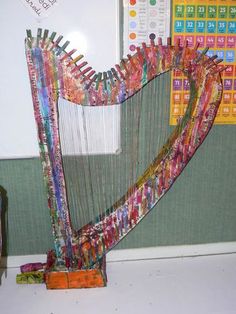 a large colorful harp sitting on top of a table