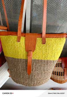 You don't have to be a millionaire to elevate your style and fashion, you need creativity and Arts. We African 1 Stores offers to you the most modern hand made tote bag woven 100% from sisal with Quality leather straps locally tunned from cows.  These beautiful handmade Tote bag originated from craftsmen living in Eastern Community in Kenya, the Akamba. Our Tote bags are woven using colored sisal and leather.The woven bag is made from products which are entirely eco-friendly and sustainable, leather to provide comfort and padding. Leathers are naturally tanned from cows. It has a zipper and an inner lining. This Tote bag is really stylish, functional and eco-friendly for everyday use, summer travels and beyond. From travel to work or a night out, makes it easier to fill your closet with et Woven Top Handle Beach Bag For Shopping, Woven Top Handle Beach Bag, Yellow Top Handle Straw Bag For Shopping, Yellow Woven Shoulder Bag For Shopping, Yellow Top Handle Straw Bag For Beach, Yellow Woven Top Handle Shoulder Bag, Yellow Beach Bag With Braided Handles For Shopping, Yellow Crochet Bag With Braided Handles For Shopping, Woven Straw Tote Bag For Shopping