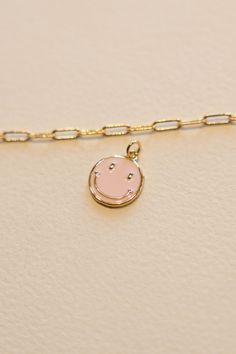 14k Gold filled Baby Pink Smiley Face Enamel Charm that adds joy to any chain. This charm adds a bit of happiness to every necklace. Hand make your custom charm necklace in Laguna Beach or build your piece online through adding a base necklace and your selection of charms. Leave us a note on your order for any special requests. 14K gold filled Tarnish resistant Enamel Rose Gold Charm Necklace With Round Pendant, Rose Gold Charm Necklaces With Round Pendant, 14k Gold Filled Pendant Charm Necklace For Gift, 14k Gold Dangle Charm Necklaces, 14k Gold Filled Pendant Charm Necklace As Gift, 14k Gold-filled Pendant Charm Necklace For Gift, Cute Rose Gold Jewelry For Friendship, 14k Gold Dangle Charm Necklaces For Gifts, Gift Pendant Charms With Adjustable Chain