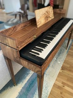 an old piano is sitting on the floor