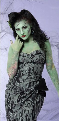 a woman dressed in zombie makeup poses for the camera