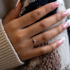 Abstract and minimal, this dainty ring features a tiny round stone paired with a sideways Sapphire Blue Marquise stone. Great gift for September Birthdays! .925 Sterling Silver Cubic Zirconia crystals Hypoallergenic. Lead and nickel free Round 1.5mm, Marquise H 3mm x W 6mm Band Ring Thickness 1.5mm #R112 Dainty Sapphire Birthstone Ring For Promise, Minimalist Crystal Diamond Ring With Birthstone, Minimalist Diamond Birthstone Crystal Ring, Dainty Cubic Zirconia Birthstone Promise Ring, Dainty Sapphire Ring With Diamond, Dainty Cubic Zirconia Sapphire Promise Ring, Fine Jewelry Tiny Birthstone Promise Ring, Dainty Oval Birthstone Ring, Dainty Promise Birthstone Ring