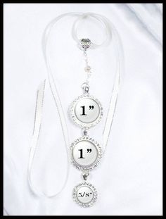 "Bridal Bouquet Photo Charm in Rhinestones on Jewel Chain With Two Charms, Wedding Bouquet Memento, Wedding Bling, Shiny Gold or Silver Tone This piece is made up of a bead chain consisting of glass pearls, crystals, and two rhinestone studded photo frames for a loved one. The top charm holds a 1\" image and the bottom charm holds a 5/8\" image. This would make a wonderful shower gift as a memento for the bride. This would also make a lovely and touching charm to add to the ring bearer pillow. Y Adjustable Rhinestone Wedding Necklace, Adjustable Rhinestone Crystal Necklace For Wedding, Adjustable Rhinestone Necklace For Wedding, Adjustable Sparkling Rhinestone Necklace For Wedding, Adjustable Bridal Accessories With Rhinestones, Adjustable Rhinestone Bridal Accessories, Adjustable Sparkly Rhinestone Necklace For Weddings, Adjustable Rhinestone Bridal Accessories For Wedding, Wedding Rhinestones Necklaces