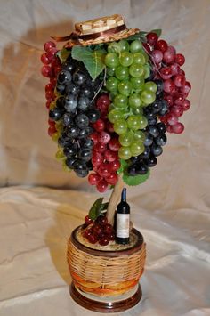 a bunch of grapes sitting on top of a basket