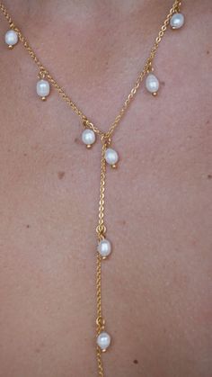 Nothing is quite as graceful as a pearl necklace. Pearl jewelry exudes class and elegance. This lariat style drop pearl necklace makes the perfect centerpiece of all your favorite outfits. Dainty chains along with dainty freshwater pearls. 18k Gold Plated Stainless Steel Chain Imitation pearl Quality: Waterproof, Hypoallergenic, Tarnish Free 100% Eco-Friendly; No Nickel, Chromium and Lead Pearl Dangle Lariat Necklace, Pearl Lariat Necklace With Clavicle Chain, Pearl Lariat Necklace With Adjustable Chain, Elegant Lariat Pearl Necklace With Clavicle Chain, Elegant Pearl Dangle Lariat Necklace, Elegant Pearl Lariat Necklace With Dangle, Elegant Pearl Lariat Dangle Necklace, Elegant Pearl Lariat Backdrop Necklace, Elegant Pearl Charm Dangle Lariat Necklace