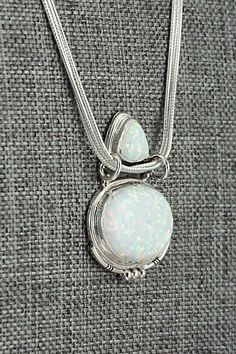 This opalite and sterling silver necklace was made by Navajo silversmith Annie Spencer. The back is stamped R.B. and .925.Necklace: 18"Length: 1 1/4"Width: 1"Free shipping on all orders! We ship with USPS and always include tracking. All orders ship within a day of payment.Returns are accepted up to 30 days after you receive your order. Just send us a message. Our shop offers cash back or store credit. The item must be returned in new condition. Artisan Silver Opal Necklace, Sterling Silver Necklace, Sterling Silver Necklaces, Silver Necklace, Sterling Silver, Free Shipping, Silver