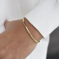 "14K solid gold cuff bracelet The bracelet will be shipped in a gift box * 14K solid gold. It is about 3.25mm width. Please select the size of your wrist.  If your wrist is 6\", please purchase a 6.25\" or 6.5\"bracelet. (If you order a 6\" bracelet, actual cuff length will be 5\" plus 1 inch opening.)" Luxury Adjustable Minimalist Cuff Bracelet, Classic Everyday Bangle, Tarnish Resistant, Classic Everyday Tarnish-resistant Bangle, Classic Adjustable Bangle For Everyday Luxury, Everyday Polished Yellow Gold Cuff Bracelet, Timeless Gold Cuff Bracelet For Everyday Wear, Everyday Gold Timeless Cuff Bracelet, Everyday Luxury Polished Cuff Bracelet, Minimalist Rose Gold Bracelet With Polished Finish