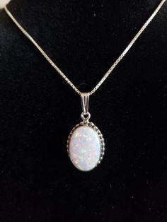 *10x14mm Oval white Opal Necklace *Lab Created Opal *Sterling Silver *Free Shipping *Handcrafted In USA *Jewelry ship in Gift box *Necklace length: 18 inches or 20”*Cabochon may vary in color *Lovely necklace with a pendant on a sterling silver chain with spring ring closure, this necklace is so pretty . A must for any occasion .Thank You For Looking ,And Check Out More Items In My Etsy Shop For More Great Deals, Also We Add More Jewelry To Etsy Shop Regularly https://www.etsy.com/shop/Turquoise Box Necklace, Usa Jewelry, Necklace Box, Lovely Necklace, Opal Necklace, White Opal, Necklace Handmade, Sterling Silver Chain, Spring Rings