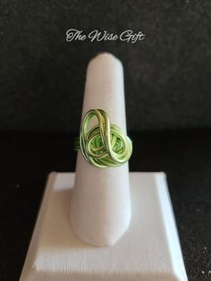 Hello & Welcome! In this listing you will find an adorable, handcrafted aluminum wire wrapped ring. Size 8 Made using 16 lime green aluminum wire & lot's of love. It is non-adjustable & is true to size. You will receive the exact ring that is shown in the photos. Free gift wrapping is available. If you're sending the ring as a gift, please mark the gift option or leave me a note in the "notes" section during checkout. If you have any questions, feel free to send me a message & I'll be happy to assist you. Thanks for taking a look & have yourself a beautiful day!♥ Hand Wrapped Green Ring For Gift, Green Wire Wrapped Rings, Adjustable Green Nickel-free Ring, Green Wire-wrapped Rings For Jewelry Making, Green Wire Wrapped Rings For Jewelry Making, Adjustable Green Wire Wrapped Rings, Unique Green Wire Wrapped Rings, Green Wire Wrapped Promise Ring, Saint Ann