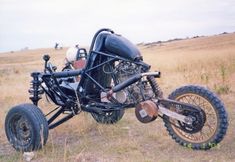 an off road motorcycle parked in the middle of a field