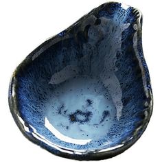 a blue and white bowl sitting on top of a table