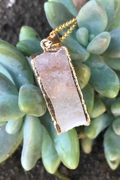 "Beautiful gold dipped and gold edged white raw druzy quartz pendant on gold colored clasp chain necklace. The rectangular prism shaped crystal is about 1\" long and 0.5\" wide. Please note that no two stones are alike and therefore color, shape and size may vary slightly. You can choose your necklace length from the drop-down menu. In case you would like a length besides the listed options, leave a note at checkout. Item will be shipped 1 - 2 business days after purchase. Back to my shop with i Gold Minimalist Jewelry With Natural Stones, Minimalist Gold Jewelry With Natural Stones, Gold Mineral Crystal Spiritual Necklace, Gold Spiritual Mineral Crystal Necklace, Gold Necklaces With Rectangular Natural Stones, Gold Quartz Necklace With Spiritual Style, Gold Mineral Crystal Necklaces With Spiritual Style, Gold Necklace With Rectangular Natural Stones, Gold Rectangular Necklaces With Natural Stones