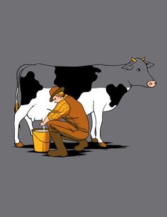 a man kneeling down next to a cow with a bucket on it's back