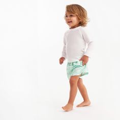 These two swim trunks are just what your little guy needs to have a blast on a sunny day of water fun. Whether you're on a beach getaway, chilling by the pool, or having water adventures at home, these swim trunks keep your baby boy or toddler boy protected from the sun with UPF 50+ fabric and let him move comfortably thanks to the stretchy waistband. Plus, they're a breeze to clean in the washing machine, so you can quickly get ready for the next adventure after each exciting day of play! Our e Day Of Water, Toddler Boy Swim Trunks, Beach Relaxing, Simple Machine, Baby Size Chart, Boys Swim Trunks, Gerber Baby, Sprinklers, Cotton Sleepwear