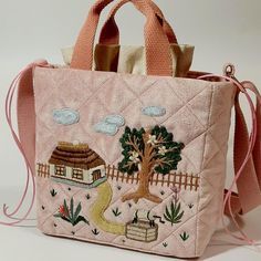 Quilted textile velvet bag in a delicate pink color. The bag is very pleasant to the touch, soft, but structured, keeps its shape. The bag is decorated with original handmade embroidery on a household theme. Bag dimensions: width 20 cm height 20 cm depth 10 cm The bag is lined, has short handles and a long strap that allows you to carry the bag over your shoulder. Inside the bag there is a pocket that closes with cords. The bag is made of 100% cotton. If you wish, you can choose a different fabric color and change the embroidery style. Any individual changes, depending on their complexity, may affect the final cost of the bag. This aspect will be discussed with the manager during the negotiations. Recommended care: dry cleaning Square Bucket Bag With Dust Bag As Gift, Pink Rectangular Bucket Bag As Gift, Pink Rectangular Bucket Bag For Gift, Trendy Pink Embroidered Bag, Embroidered Tote Bucket Bag For Everyday Use, Hand-stitched Satchel For Daily Use, Handmade Top Handle Box Bag For Gift, Trendy Handmade Rectangular Canvas Bag, Pink Embroidered Shoulder Bag For Shopping