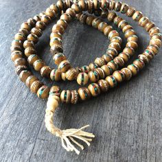 Unique and powerful Nepali Yak Bone Mala. Each bead has bras and small stone details. A unique unisex piece that will be perfect for your day by day outfits. The Mala is 40.6cm- 16 inch long A most have addition to your jewelry collection. Enjoy Con salud Bohemian Jewelry With Wooden Beads, Bohemian Round Brown Beads, Bohemian 8mm Beads Necklace For Festival, Bohemian Necklace With 108 Round Beads, Bohemian Festival Mala With Wooden Beads, Bohemian Round Beads For Meditation, Gold Necklaces With Wooden Beads For Festivals, Gold Jewelry With Wooden Beads For Festivals, Bohemian Wooden Beads Mala For Festival