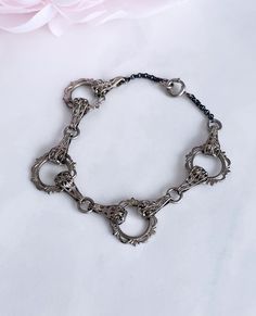 Lovely vintage bracelet from around the 1930s in a classic Art Deco style featuring decorative circles connected by filigree links.  Silver toned metal, spring ring clasp.  Good vintage condition with just a bit of patina on the chain commensurate with age.  Will fit a medium wrist comfortably. Filigree Bracelet, Art Deco Bracelet, Metal Spring, Vintage Bracelet, Bracelet Vintage, Silver Filigree, Vintage Bracelets, Bracelet Silver, Art Deco Style