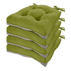 four green cushions stacked on top of each other