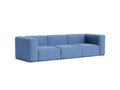 a blue couch sitting on top of a white floor