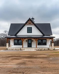 a large white house with a black roof