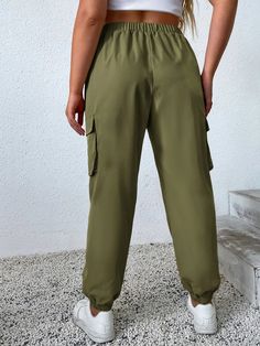 Introducing our Solid Color Flap Pocket Cargo Pants, the ultimate blend of style and practicality. These pants feature a solid color design that adds a modern touch to your outfit. The standout feature of these cargo pants is the flap pockets on the bottom, providing both a stylish look and convenient storage for your essentials. The high waist silhouette flatters your figure and adds a trendy element to your ensemble. Details: Pattern Type: Plain Details: Pocket Waistline: High Waist Fit Type: Green Sweatpants With Pockets For Outdoor Activities, Solid Color Sweatpants With Side Pockets And Tapered Leg, Bottoms With Pockets And Tapered Leg, Solid Tapered Leg Bottoms With Pockets, Cargo Pocket Sweatpants For Outdoor Activities, Utility Cargo Style Sweatpants For Outdoor Activities, Utility Cargo Sweatpants For Outdoor Activities, Tapered Leg Bottoms With Side Pockets For Outdoor Activities, Solid Color Pants With Side Pockets For Outdoor Activities