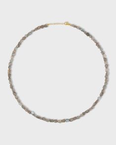 This exquisite piece of jewelry is handmade in NYC, featuring a gorgeous labradorite gemstone bead in a luxurious 14k gold setting. With its iridescent hues of blue, green, and gold, the labradorite gemstone is known for its mystical properties that promote intuition and spiritual awareness. This necklace adds a touch of elegance to any outfit, whether you're dressing up for a special occasion or adding a pop of glamour to your everyday wear. 14 Karat Yellow Gold Labradorite, 72 carats 18 to 19 Elegant Labradorite Gemstone Bead Crystal Necklace, Elegant Labradorite Crystal Necklace With Gemstone Beads, Elegant Crystal Necklace With Gemstone Beads And Labradorite, Gold Labradorite Gemstone Beaded Necklace, Gold Beaded Necklace With Labradorite Stones, Gold Labradorite Crystal Necklace With Gemstone Beads, Gold Crystal Necklaces With Gemstone Beads, Labradorite Gemstone Bead Crystal Necklaces, Labradorite Gemstone Crystal Necklaces With Round Beads