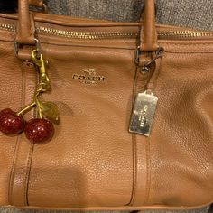 Excellent Condition, Super Clean Interior. Gold Accents. Charm Not Included. Great Bag For Fall! Brown Coach Shoulder Bag With Branded Hardware, Timeless Coach Shoulder Bag With Gold-tone Hardware, Brown Coach Bags For On-the-go, Brown/black Coach Bag, Coach Brown Shoulder Bag With Silver-tone Hardware, Gold Accents, Coach Bags, Leather Shoulder Bag, Camel