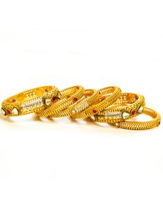 Buy Indian Kada bangles online! Ladies' gold bangle jewelry near me. Ruby bangle design with Kundans on gold bangles. Various Traditional gold bangle designs are available. Indian bridal jewelry made with love. Handcrafted Indian jewelry in Bay Area, San Francisco, California, USA. Now shipping worldwide! Gold Bridal Sets With Stone Work For Celebration, Gold Bracelets With Elegant Design For Festive Occasions, Intricate Design Gold Bracelet For Wedding, Festive Gold Bracelet With Elegant Design, Intricate Gold Bracelet For Weddings, Festive Bangle With Elegant Design, Festive Gold-plated Bracelet For Wedding, Wedding Gold Bracelet With Intricate Design, Gold Plated Bangle For Marriage