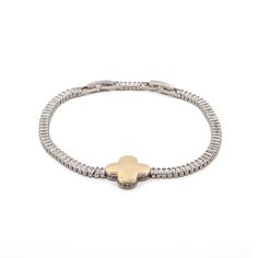 Gold Clover Charm Baguette Diamond Bracelet, a unique and meaningful accessory that seamlessly blends elegance with versatility. This stunning bracelet features a delicate baguette diamond chain that beautifully catches the light, paired with a central gold-plated clover charm symbolizing luck and prosperity.  The bracelet includes a special adjustable feature, allowing you to easily shorten or lengthen it to suit your preference.  Perfect for both daily wear and special evening events, this stylish and refined bracelet adds a touch of sophistication to any outfit, making it a versatile choice for any occasion. Details White gold plated on brass Baguette style Cz Diamonds  Adjustable bracelet size 6 1/4'' - 7. 5'' Charm height 0. 7'' Charm width 0. 7'' Avoid contact with chemicals, makeup, July Birthstone Jewelry, August Birthstone Jewelry, Clover Charm, Diamond Chain, Jewelry Ring Box, Pearl Jewellery Earrings, Evil Eye Jewelry, Mens Jewelry Bracelet, Eye Jewelry