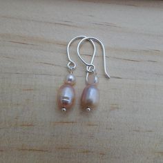 Pink pearl drop earrings with small pearl accent on sterling silver earrings Metal Dangle Clip-on Earrings With Pearl Drop, Pink Pearl Drop Earrings In Sterling Silver, Pink Adjustable Pearl Drop Earrings, 14k Gold-filled Pearl White Drop Earrings, White 14k Gold-filled Drop Pearl Earrings, Pink Pearl, Pearl Drop Earrings, Pearl Drop, Sterling Silver Earrings