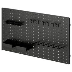 a black pegboard with four bins on it