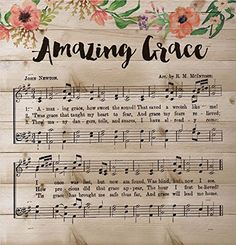 a wooden plaque with music notes on it that says,'amazing grace'and is surrounded by flowers