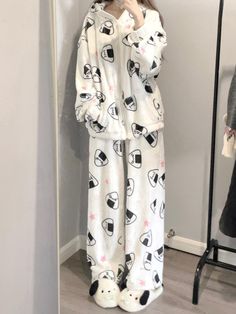 Embrace the charm of Japanese aesthetics with this adorable pajama set, featuring delightful onigiri (rice ball) and star patterns throughout. The top is designed with a cozy hood and a convenient zipper closure, complemented by practical pockets on each side of the placket. The pants boast a comfortable elastic waistband, ensuring a snug fit for a restful night's sleep.  Price includes one pajama set only.   	 		 			Top Size 			S 			M 			L 		 		 			Length 			66.5 			68 			69.5 		 		 			Bust White Relaxed Fit Winter Sleepwear, White Winter Sleepwear For Overnight, Cozy White Pajama Party Sets, Cozy White Sleepover Sets, White Loungewear Sets For Winter, White Winter Loungewear Sets, White Winter Pajama Party Sets, White Pajama Party Set For Winter, White Sets For Winter Pajama Party