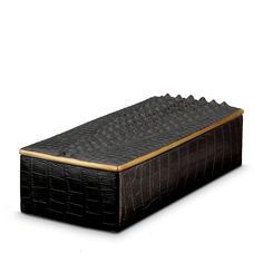 a black crocodile skin and leather box with gold trim