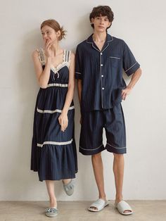 Couple pajamas set in soft cotton fabric. Man's contrast piped trimming short-sleeved shirt with a resort collar, buttons at front, gently dropped shoulders, and an open chest pocket. Shorts with covered elastic at waistband. Woman's nightgown in calf-length, lace-trimmed sweetheart neckline and shoulder straps, and gathered tiers. Unlined.- Couple pajamas- A-line- Midi- Sleeveless Summer Pajama Party Sleepwear With Pockets, Cotton Sleepwear With Pockets For Vacation, Summer Pajama Shorts With Pockets For Sleep, Blue Summer Sleepwear For Home, Summer Pajama Shorts With Pockets For Pajama Party, Summer Nightgown For Pajama Party With Relaxed Fit, Relaxed Fit Summer Nightgown For Pajama Party, Blue Summer Sleepwear With Pockets, Blue Summer Home Sets