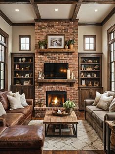 a living room with two couches and a fire place in it's center