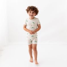 Our toddler pajama sets are breathable, super soft, and wildly comfy. Each set comes with a short-sleeved top and matching shorts made with luxurious, eco-friendly viscose from bamboo fabric for all-over comfort without the negative environmental impact. Wash before first use Machine wash cold, gentle cycle Tumble dry low Iron low if desired Do not bleach 95% Viscose from bamboo, 5% Spandex No tag for extra comfort Family Matching Loungewear Sets With Short Sleeves, Playful Short Set For Loungewear, Playful Short Sleeve Top For Loungewear, Playful Short Sleeve Short Set For Loungewear, Playful Short Sleeve Tops For Pajama Party, Playful Relaxed Fit Short Sleeve Sets, Green Short Sleeve Sets For Sleepover, Playful Short Sleeve Sleepwear For Loungewear, Playful Short Sleeve Relaxed Fit Sets