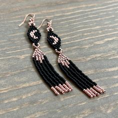 Handmade beaded crescent moon tassel earrings. Stunning earrings inspired by astrology with a subtle witchy vibe. These have a lovely dangle and drape made from high quality Japanese glass seed beads and strong durable nylon beading thread.   Fun yet sophisticated with an option of either matte black paired with metallic rose gold, or matte dusty pink paired with metallic maroon. Earring hooks are rose gold.  Earrings measure about 3.5" (7.6cm) long (3.25" earring length + 1/4" earring hook). Ad Witchy Beaded Earrings, Goth Beaded Earrings, Crescent Moon Beaded Earrings, Moon Phases Beaded Earrings, Handmade Black Moon Earrings, Beaded Crescent Moon, Beading Earring, Metallic Rose Gold, Beading Thread